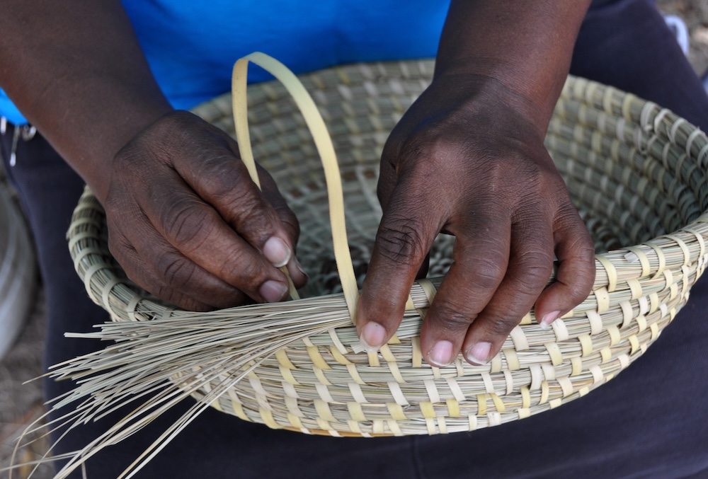 Closeup of a traditional Gullah basket-weaving demonstration