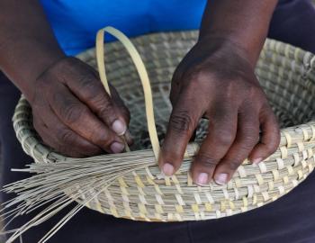 Closeup of a traditional Gullah basket-weaving demonstration