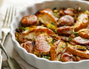 Closeup of a sausage casserole dish on a restaurant table