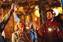 people holding sparklers