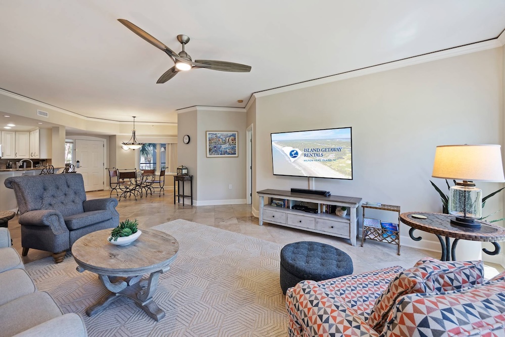 Vacation rental interior open-layout design and large flat-screen TV