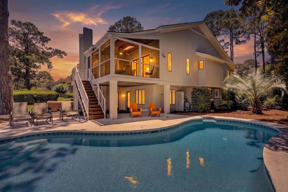 Vacation rental backyard with private pool at dusk